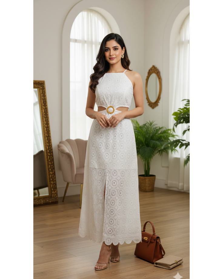 Woman in a white lace dress standing in a well-lit room with large windows and decorative elements.